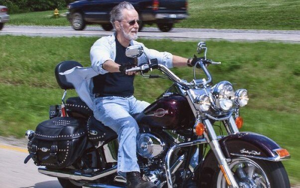 man riding on motorcycle